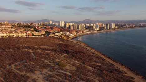 Aerial-reveal-of-a-coastal-town-in-the-Mediterranean