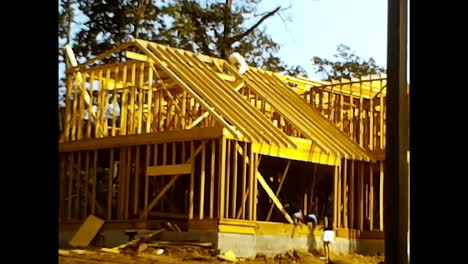 wood-filled house under construction. circa usa - 1970s: a 1970s video archive from the usa showcasing a house under construction, featuring a substantial amount of wood.