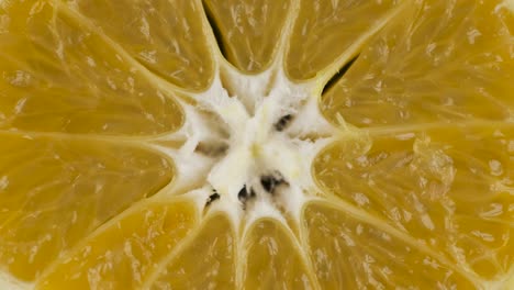 rotation, closeup of fresh, juicy pulp of an mandarin. background and texture of mandarin. top view.