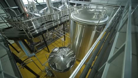 modern craft brewery. craft beer production. modern equipment in brewery, metal tanks, alcoholic drink production