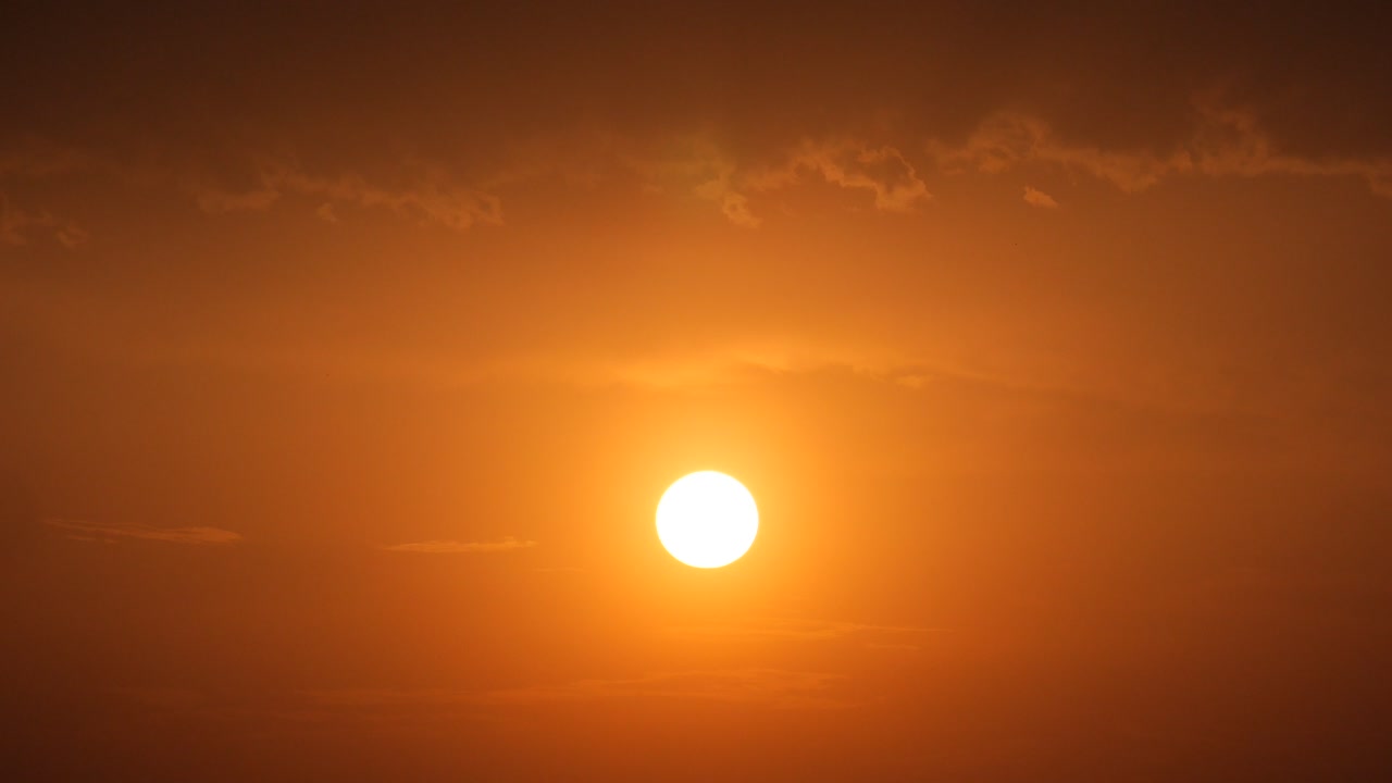 Bright Orange Sunset or Sunrise with Clouds