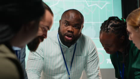 Diverse coworkers team participating in a late night briefing session