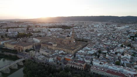 circling-aerial-view-of-mosque-cathedral-in-Cordoba,-Spain-during-blue-hour