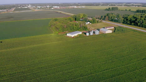 Forward-moving-aerial-drone-shot-of-farm-house