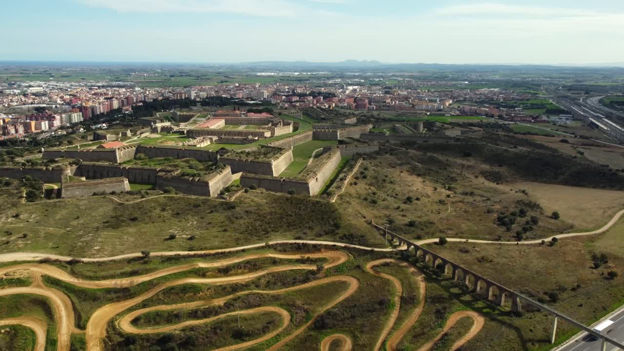 Aerial View of Fortress, Cityscape, and Motocross Track