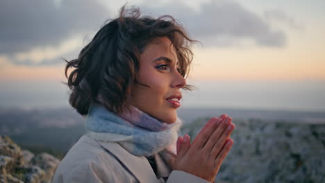 woman feeling cold rocky terrain at evening serenity closeup. portrait traveler