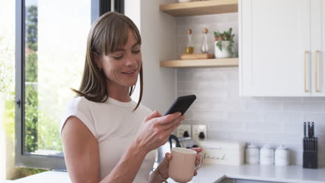 Middle-aged-Caucasian-woman-enjoys-a-morning-coffee-at-home