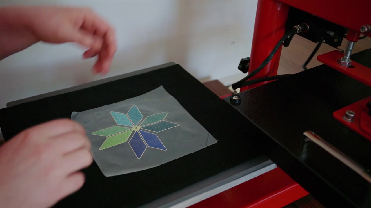 Close up footage of a professional heat press machine used for textile printing and garment customization
