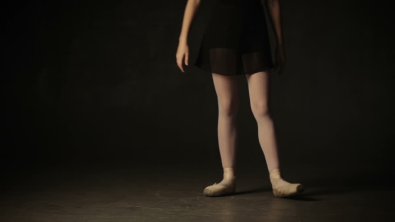 Beautiful little girl ballerina dancing in ballet studio