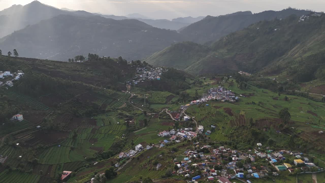 Top-down view of cultivated lands meeting natural forest patches