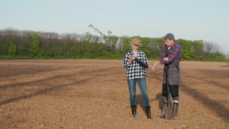 farmers planting a fruit tree