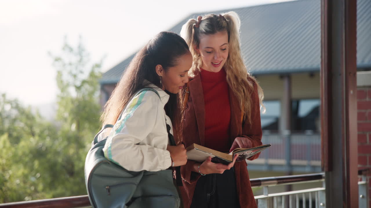 Teenage students reading together at school