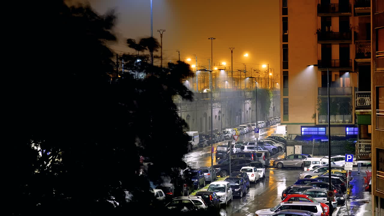 Traffic time lapse of cars driving at night with blur effect in Milan, Italy