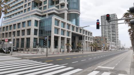 view of empty koifman street and tel aviv beach during pandemic lockdown