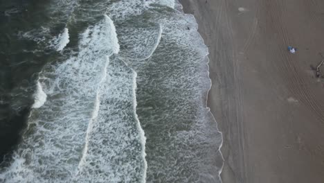 An-aerial-view-of-the-beach-in-Arverne,-NY,-during-a-beautiful-and-cloudy-evening