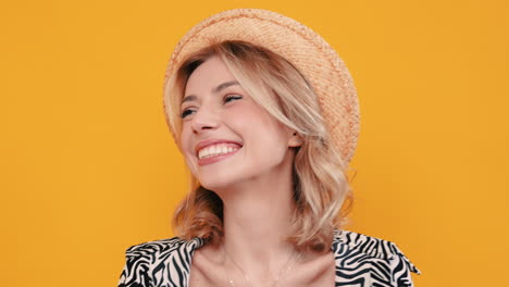 happy woman in straw hat and zebra print blouse