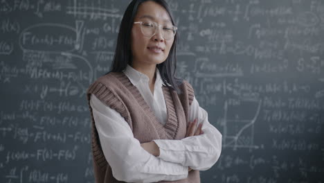 portrait of a confident female teacher in a classroom