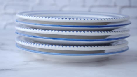 stack of blue and white dinner plates