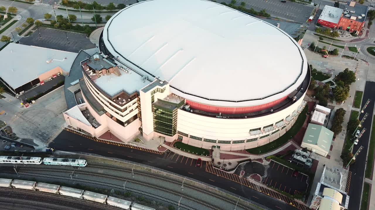 Aerial View of RTD Light Rail Train Moving by Pepsi Center Sports Arena, Denver Colorado USA