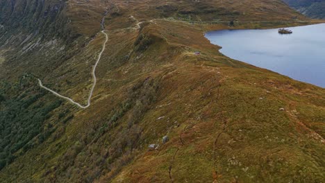 Aerial-over-the-rugged-hills-and-lakes-near-Vanylven-Municipality,-Norway