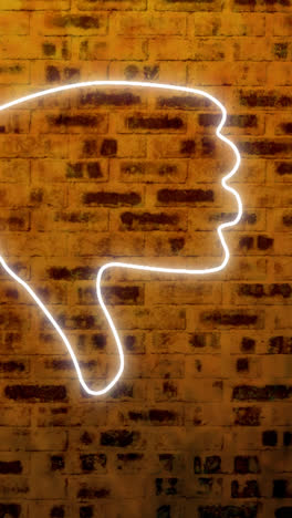 Animation-of-glowing-neon-thumb-down-icon-on-brick-wall