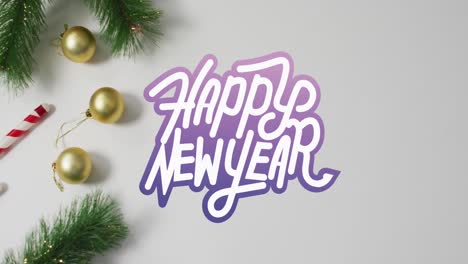 animación de texto de feliz año nuevo sobre decoraciones de navidad