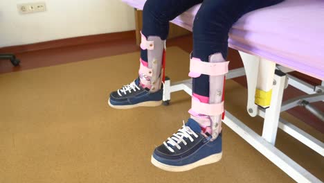 child with leg braces