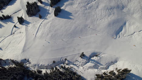 top view of tourists skiing in saalbach-hinterglemm resort town, austria