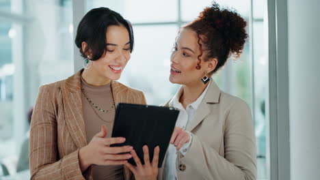 two businesswomen collaborating in the office