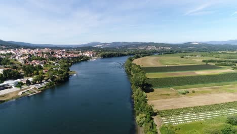 a beautiful valley with a river blue sky