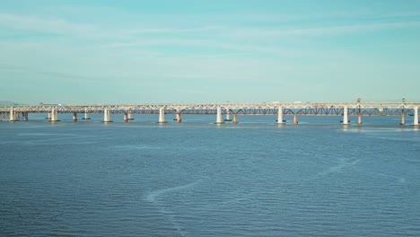 aerial establishing static of carquinez strait bridges in martinez, california, with calm waters and gentle ripples under soft sky