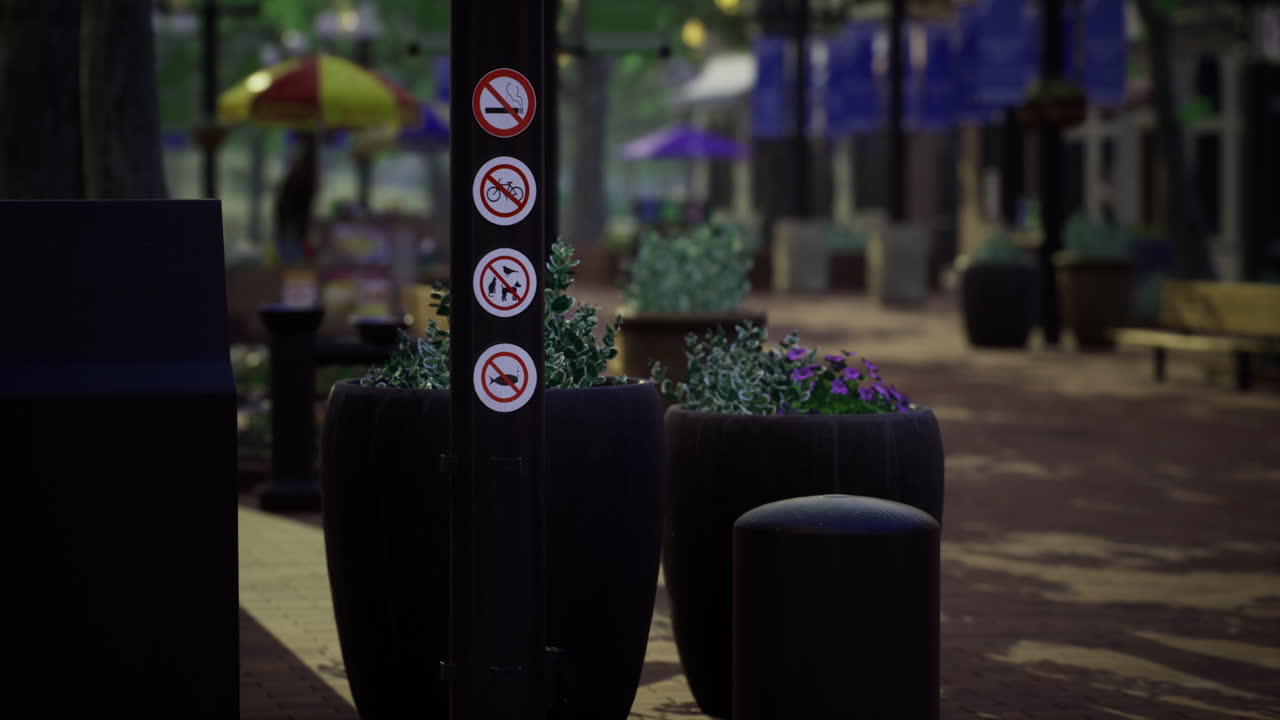 Signs conveying restrictions in a public plaza during daytime