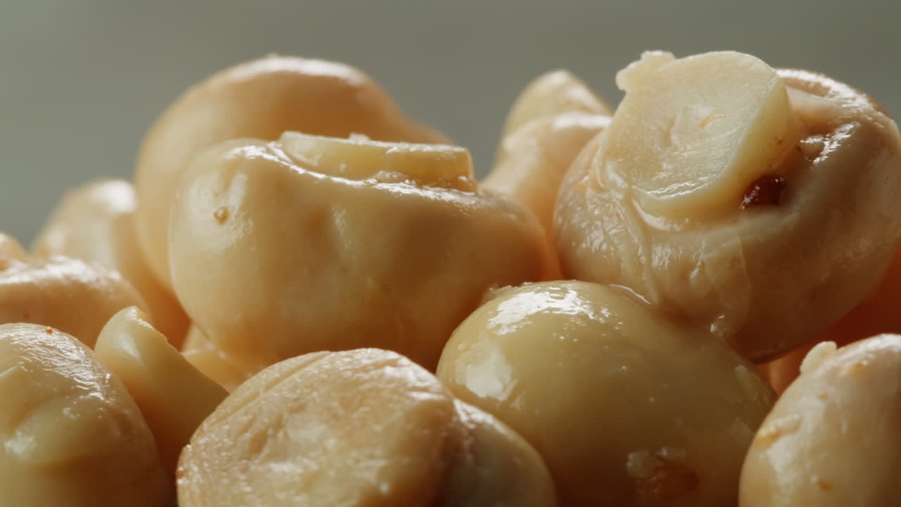 Fermented champignons, Jar with marinated mushrooms on wooden table, traditional salted marinated asian food.
