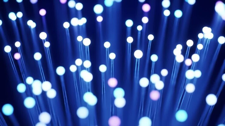 Illuminating blue and purple lights dance and pulse, showcasing the beauty of fiber optic cables. This display highlights the intricate interplay of technology and artistry in a dark space.