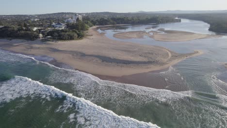 currimundi creek mouth with sand dunes near wurtulla beach on sunshine coast, qld, australia