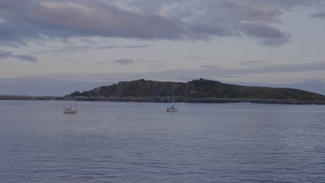 sailboats on waves in the night - coffs harbour pier nsw australia