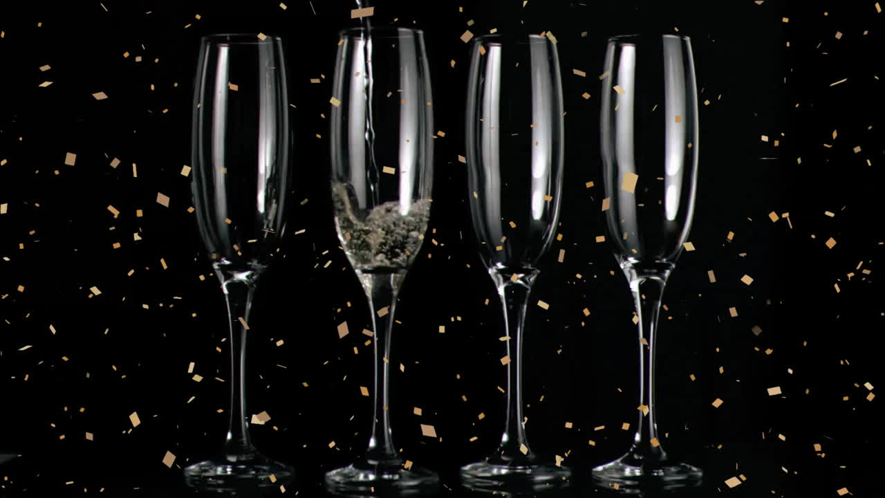 검은 바탕에  ⁇ 페인 잔 위에 떨어지는 콘페티의 애니메이션