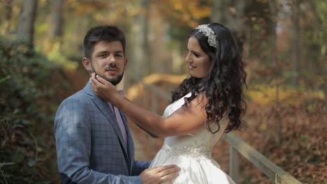 Groom-with-bride-near-mountain-hills-in-the-forest.-Couple.-Making-a-kiss