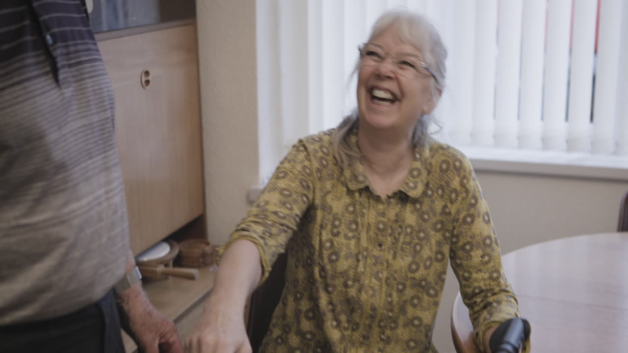 Senior woman using walker with support