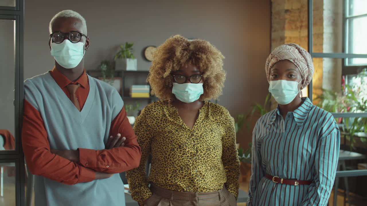 Portrait of African American Business Team in Masks in Office