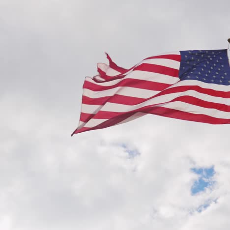 Large-Us-Flag-On-A-Background-Of-Gray-Sky-Beautifully-Illuminated-By-The-Sun-1