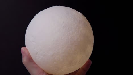 moon shaped night light lighting fixture a night scene in the dark. home lighting device at night