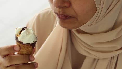 young women eating chocolate flavor ice cream