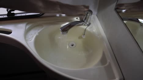 closing an indoor shower water faucet in a motorhome