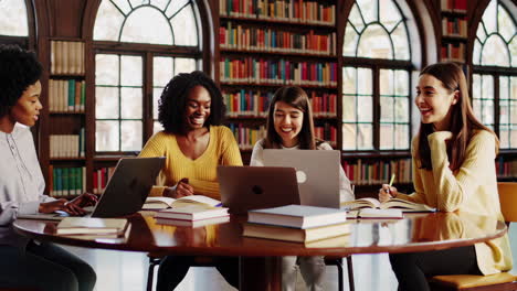 diverse group of students collaborating and studying in a university library