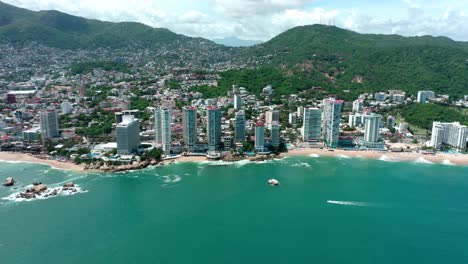 birds eye view tracking shot of beautiful acapulco coast beach in summer