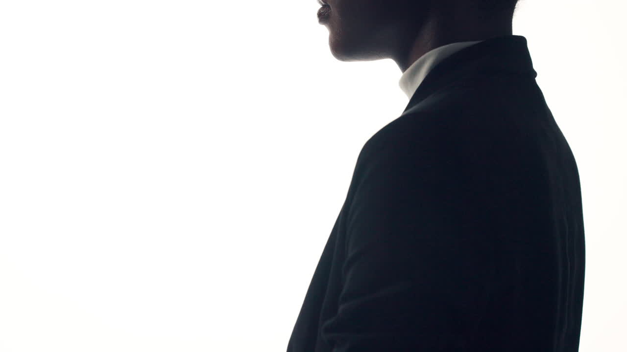 Silhouette of a person in a suit