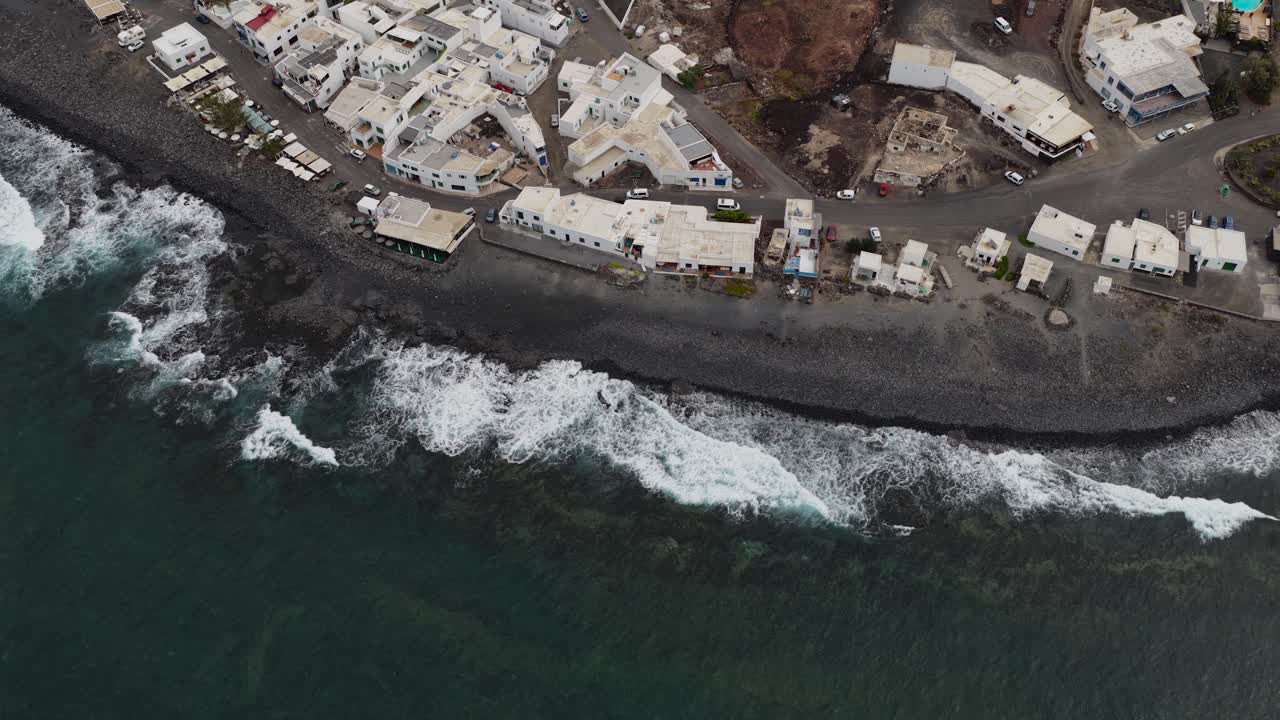 El Golfo Lanzarote aerial view across whitewashed villa fishing village volcanic island coastline
