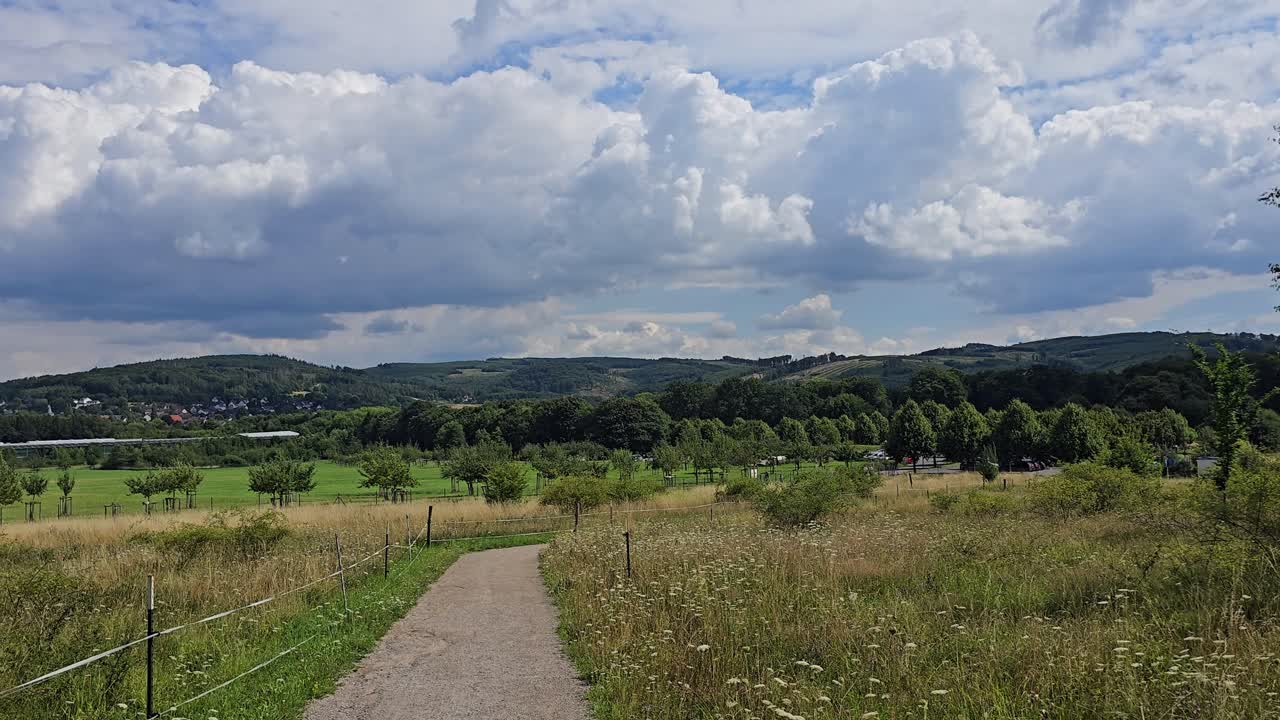 Camera pan of Hemer Sauerland landscape with dramatic cloudy sky