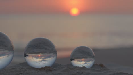 crystal balls in beautiful sunset on the beach